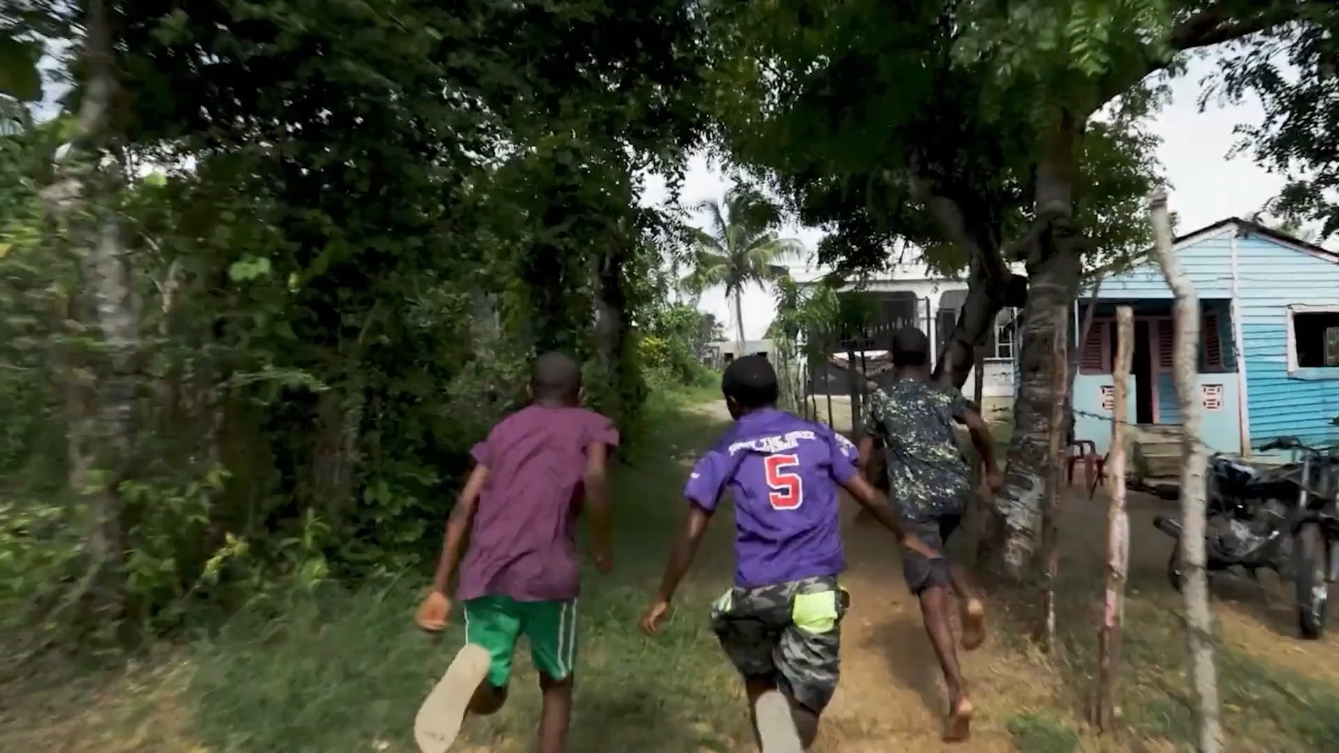 Kids running down a dirt path, an opening scene of 22